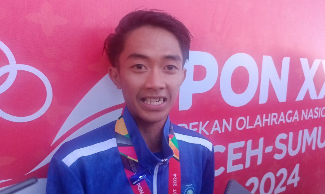 Gambar Atletik - Sabet Emas Perdana, Robi Sebut Berat Bertarung Akibat Cuaca